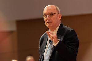 Photo of Peter Starr speaking to staff and faculty