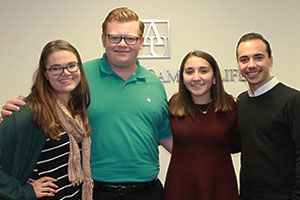 A few members of the College Democrats and College Republicans take a group picture together.