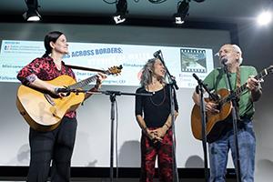 Laura DeNardis, Bethany and Peter Yarrow perform on stage.