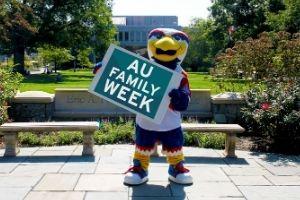 Clawed holding Family Week sign