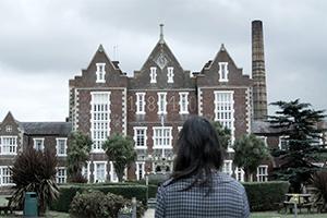 Building with person standing in front