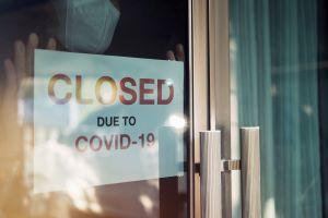 Closed sign on business door