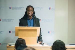 Professor Ibram Kendi stands at podium