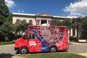 The Humanities Truck in front of Batelle-Tomkins building. There is a map of DC on the truck.