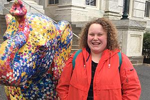 Isabel with the speckled elephant in front of Hurst Hall