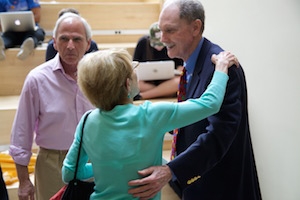 Joe Eldridge greets a guest at his retirement ceremony.