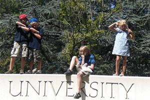 Children posing on an AU sign