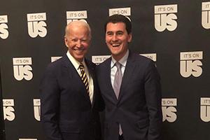 Two men smiling at an event