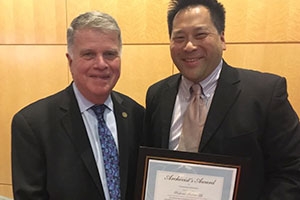 Andrew Lih hold plaque for Archivist Award