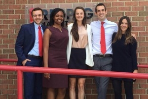 MS Marketing students stand outside marketing agency after their final class presentations.