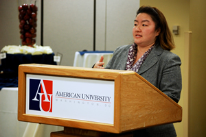 Mia Beers speaking at a podium