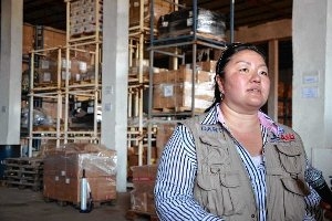 Mia Beers speaks at a warehouse with supplies to fight Ebola.