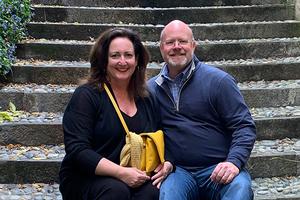 Parents sitting on steps.