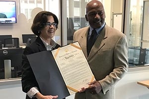 Councilmember Mary Cheh presents resolution to Professor John C. Watson, declaring October 3 as 