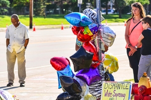 Memorial for where Minnesota African-American Philando Castile was shot by police. Balloons and a sign below that reads 