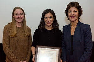 Nicole Caporino receives her award from Katherine Baucom and Michelle Craske