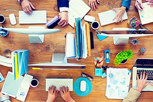 Group of Business People Working on an Office Desk