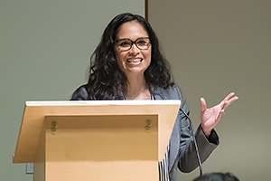 Professor speaking at a lectern