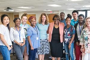 AU's first cohort of DCPS Dual Enrollment Students Poses with AU President Sylvia Burwell.