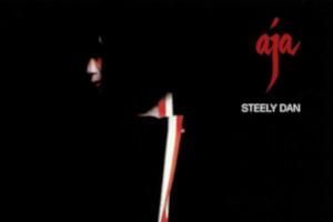 Cover art from Steely Dan album titled Aja. Human face mostly obscured by shadow.