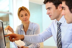 People working together in front of computer