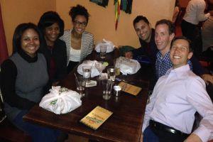 Students enjoy meal with alumni Suzanne Ffolkes, pictured left-center.