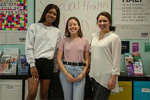 HPAC Director Mickey with Peer Health Educators Teanna and Maddie.