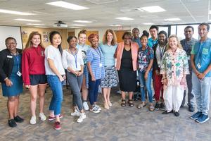 AU President Sylvia Burwell and Cheryl Holcomb-McCoy, dean of AU's School of Education, pose with students.