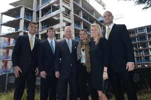 The Cassell family stands in front of the newly named Cassell Hall