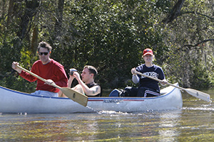 The Center for Environmental Filmmaking director Chris Palmer canoes with students in Florida during Classroom in the Wild