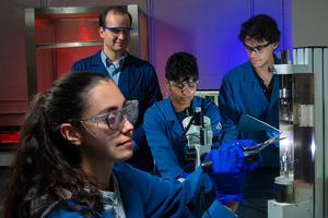 Zestos and his research team wear lab coats