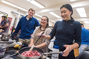 Students cooking for the Chopped food competition.