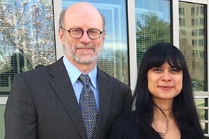 Dean Jeff Rutenbeck and Kara Andrade stand outside