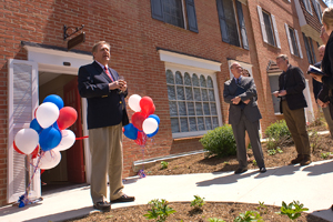 Professor Don Williamson speaks to the crowd in front of the Tax Center.