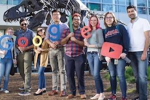 A group poses with a 