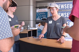 American University Game Design student Joyce Rice dealing cards for a news game she created. 