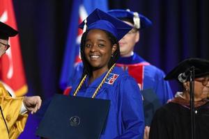 Samantha Miller accepts diploma