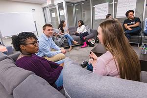 Students have a conversation during AUx