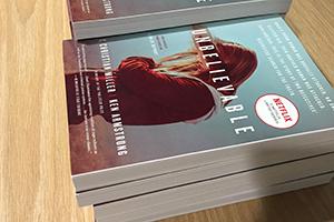 Stack of copies of the book Unbelievable