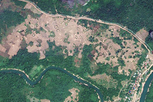 Bomb crater in a Laos field