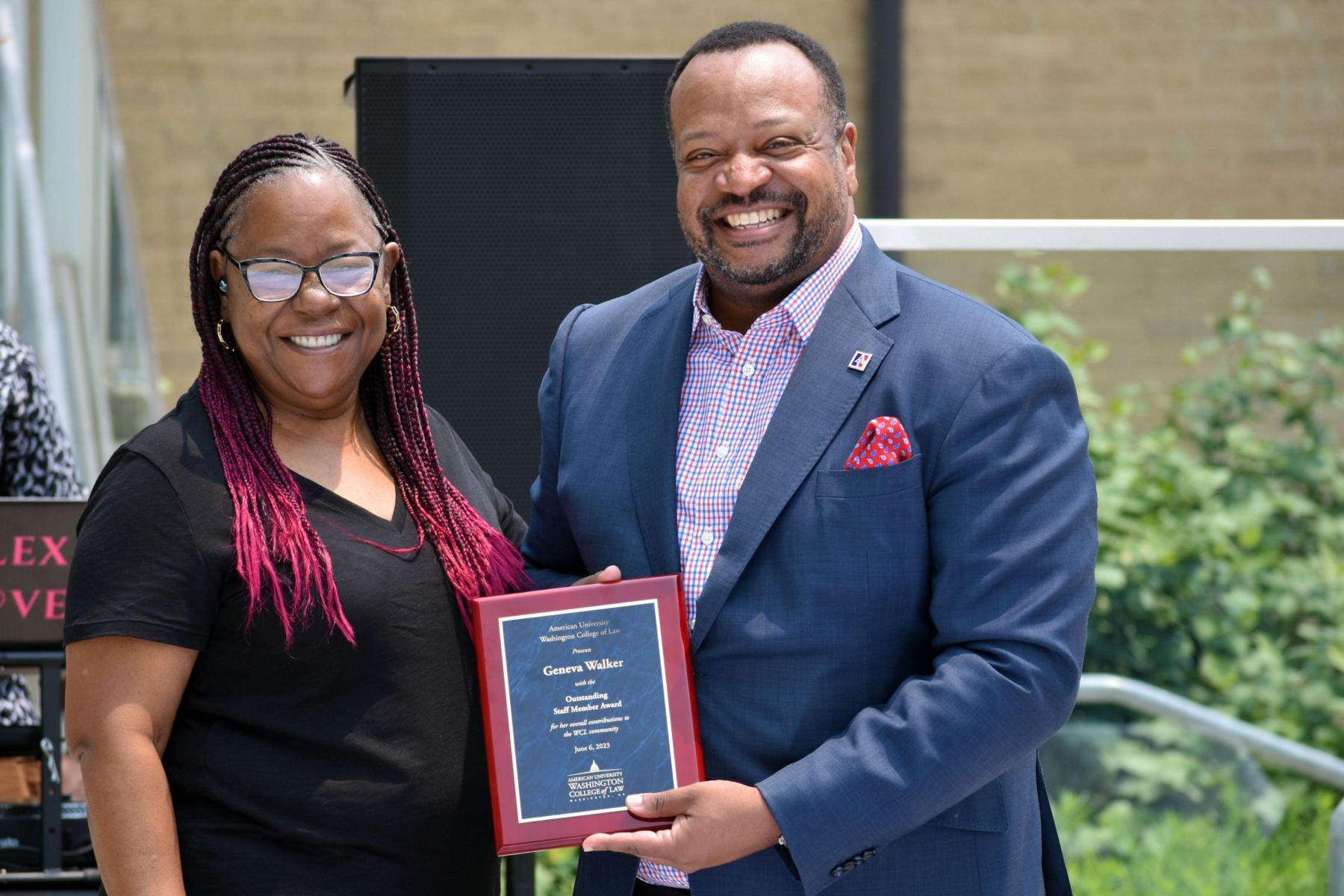 Geneva Walker receiving the Outstanding Staff Award from Dean Fairfax Geneva Walker receiving the Outstanding Staff Award from Dean Fairfax