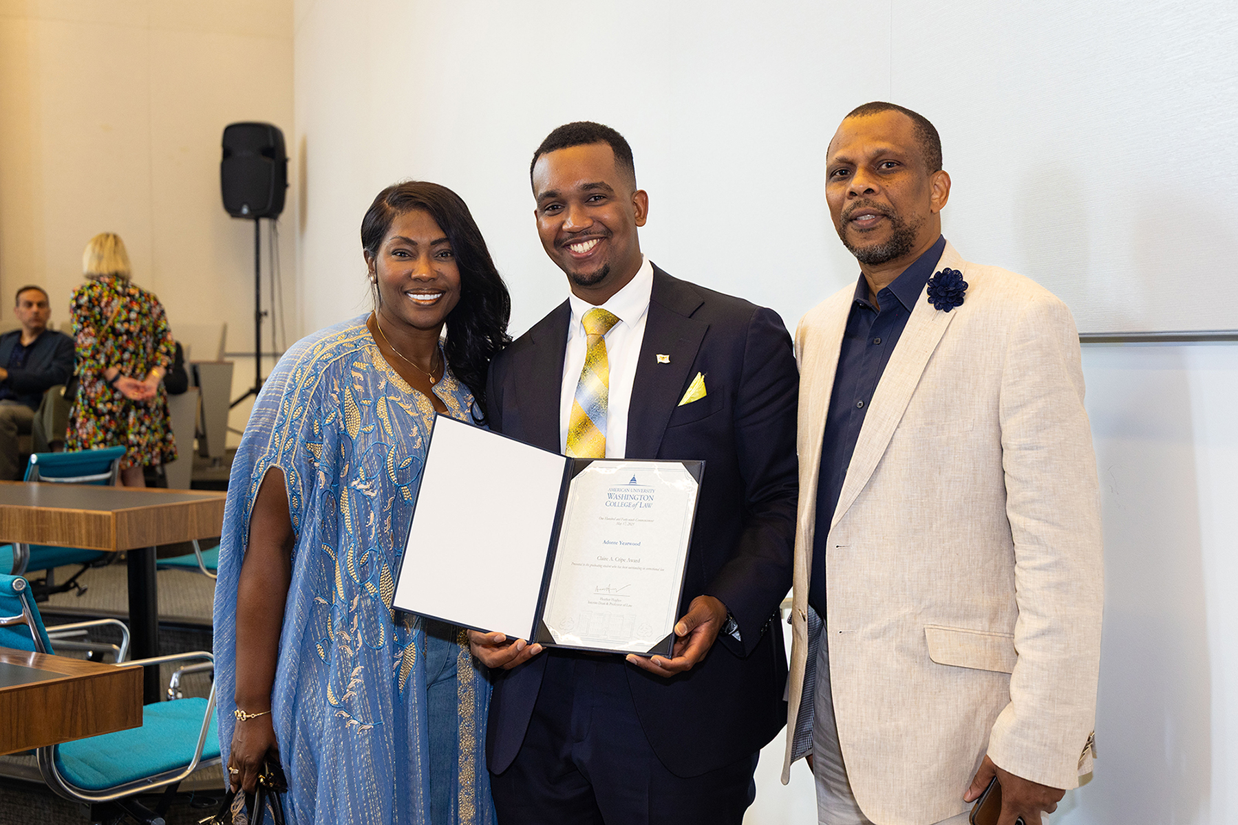 Adonte Yearwood displays his award