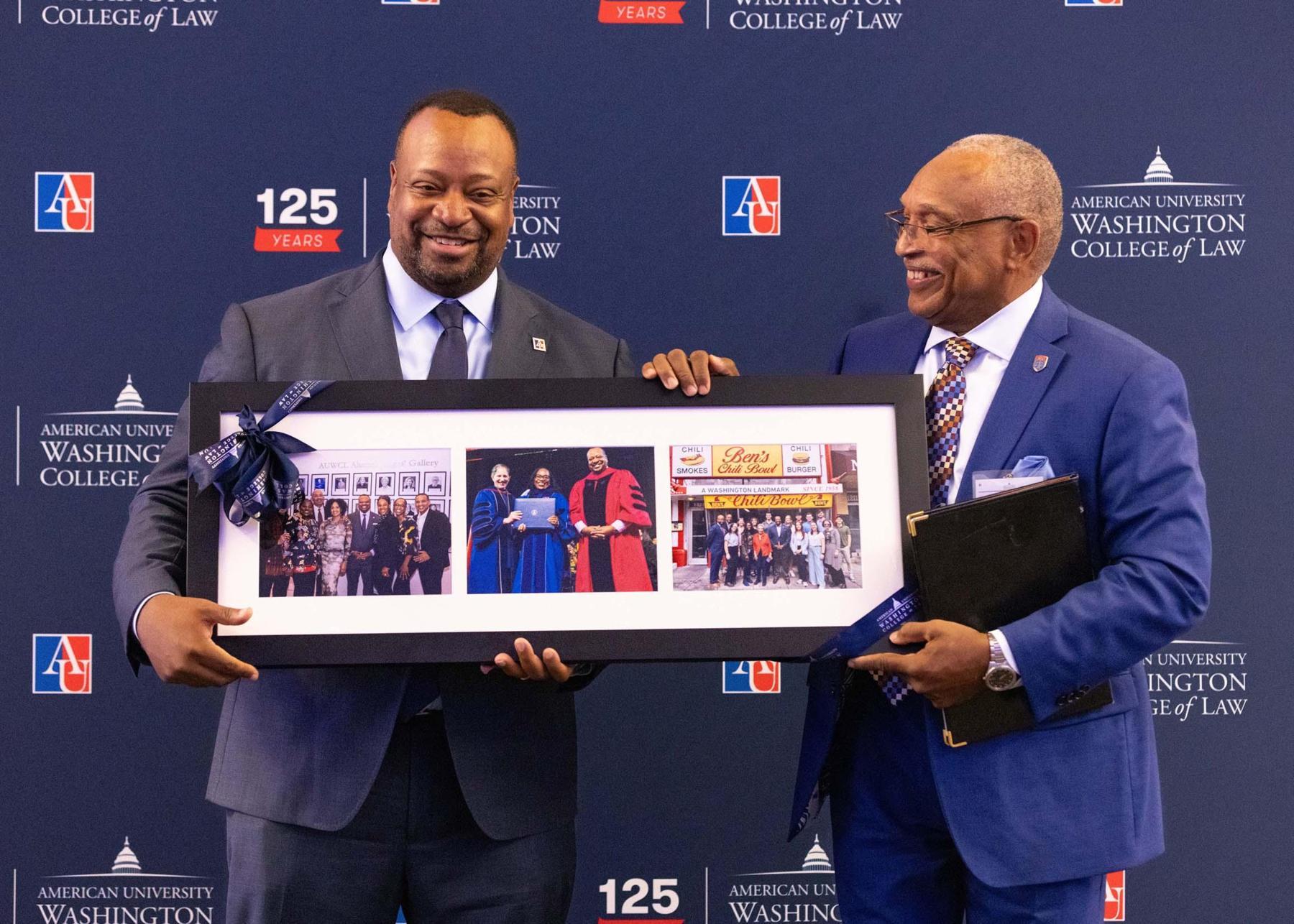 Judge Walton presenting Dean Fairfax with a memento from the alumni community Judge Walton presenting Dean Fairfax with a memento from the alumni community
